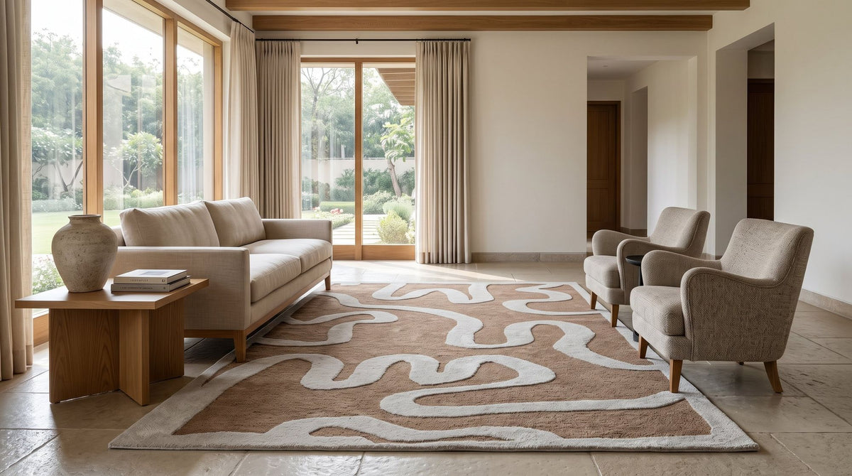 Congrand Wool Rug, an ivory line looping across camel wool, holding the whole seating group. Room is a digital render; the rug is from a product photo.