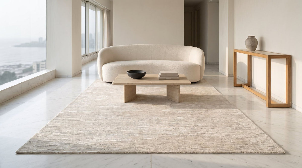 Cabella Wool & Silk Rug in Frost in a styled drawing room, hand tufted wool and silk in a pale tone on tone.