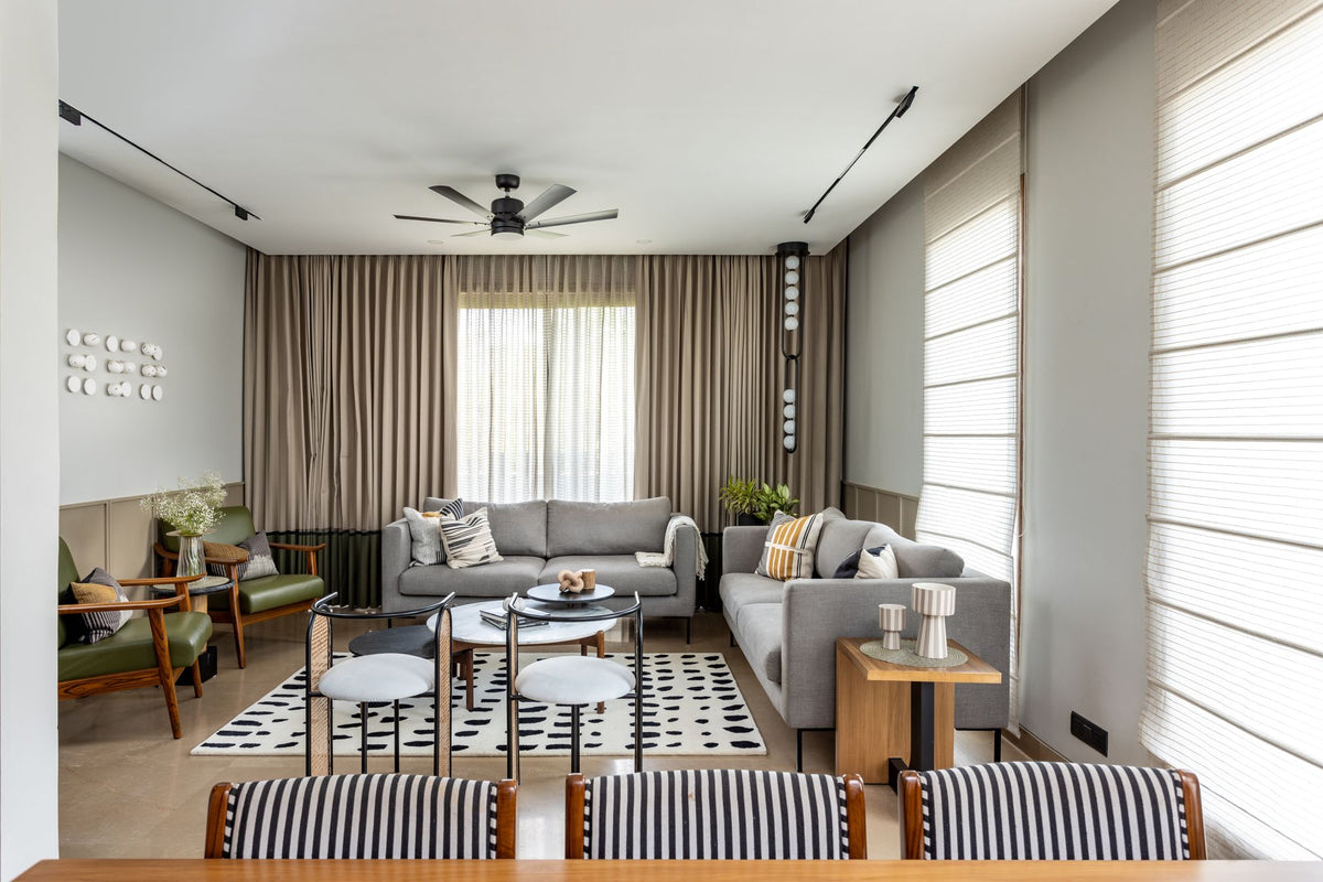 Arctic Wool Rug in a long living room, hand tufted New Zealand wool with ink marks on an ivory ground.
