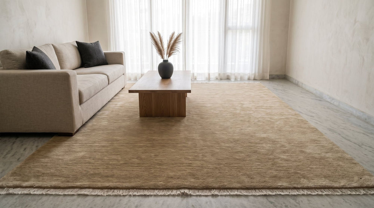 Grain Wool Rug in sandstone, handloom woven, in a family living room.