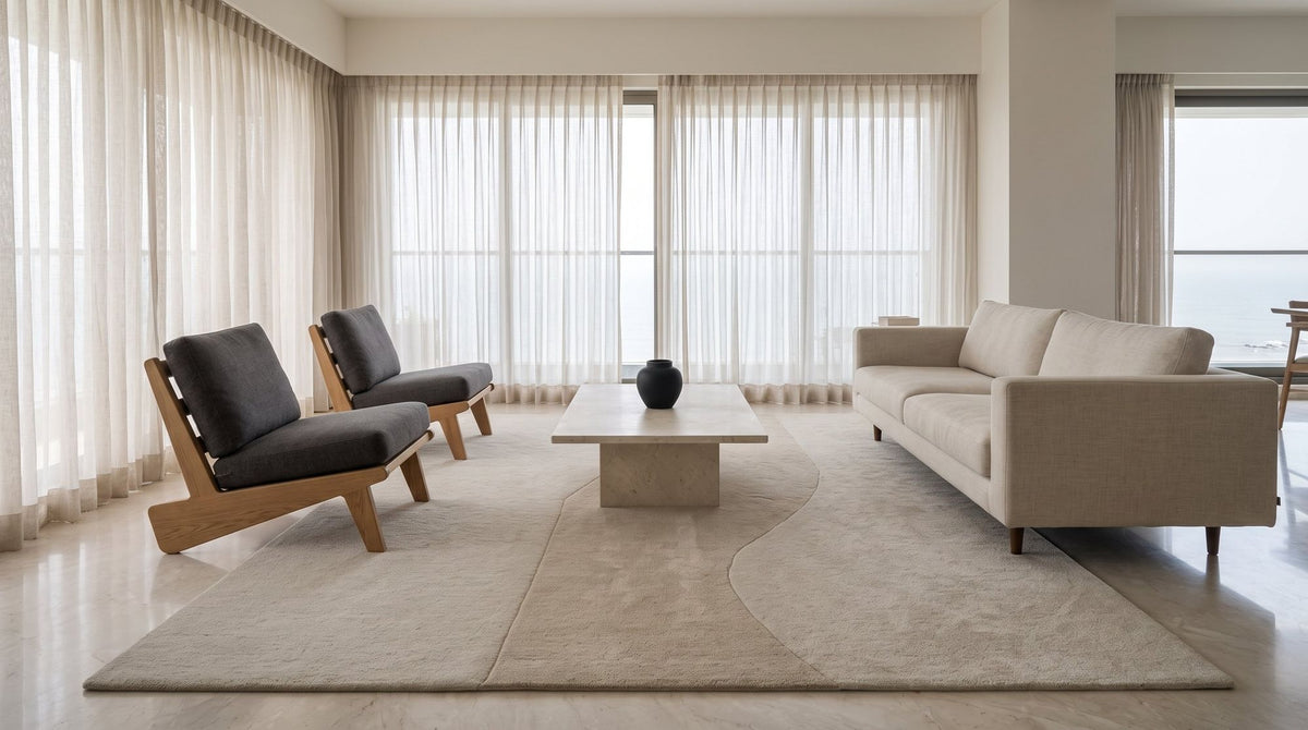 Cadence Wool Rug, hand tufted New Zealand wool in stepped ivory bands, under a full seating group. Room is a digital render; the rug is from a product photo.
