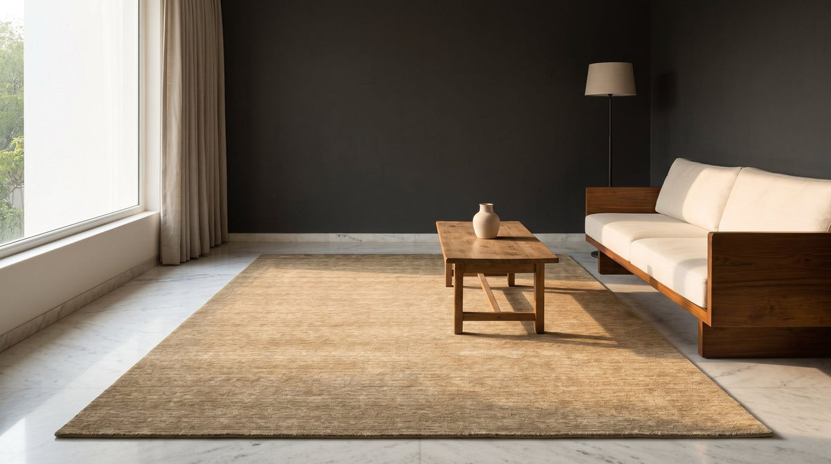 Grain Wool Rug in Tan on a marble floor in a styled living room, handloom New Zealand wool in a warm tan.