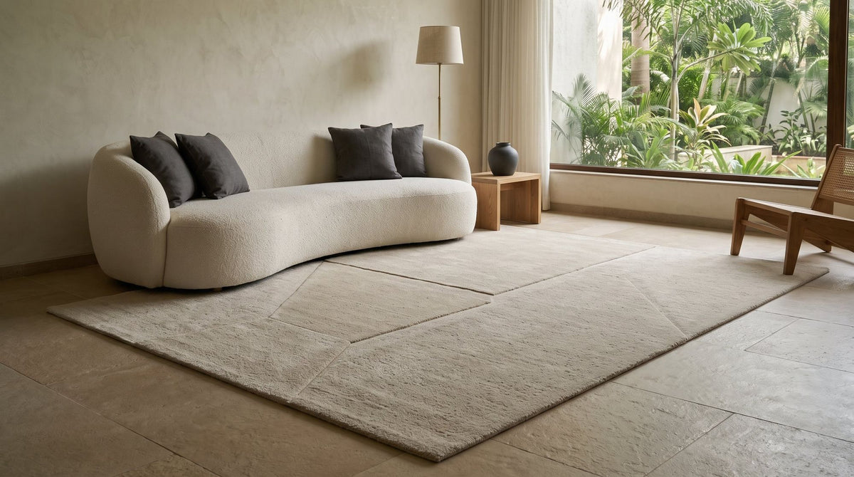 Cadence Wool Rug in a styled living room, hand tufted New Zealand wool with chevrons carved into an ivory pile.