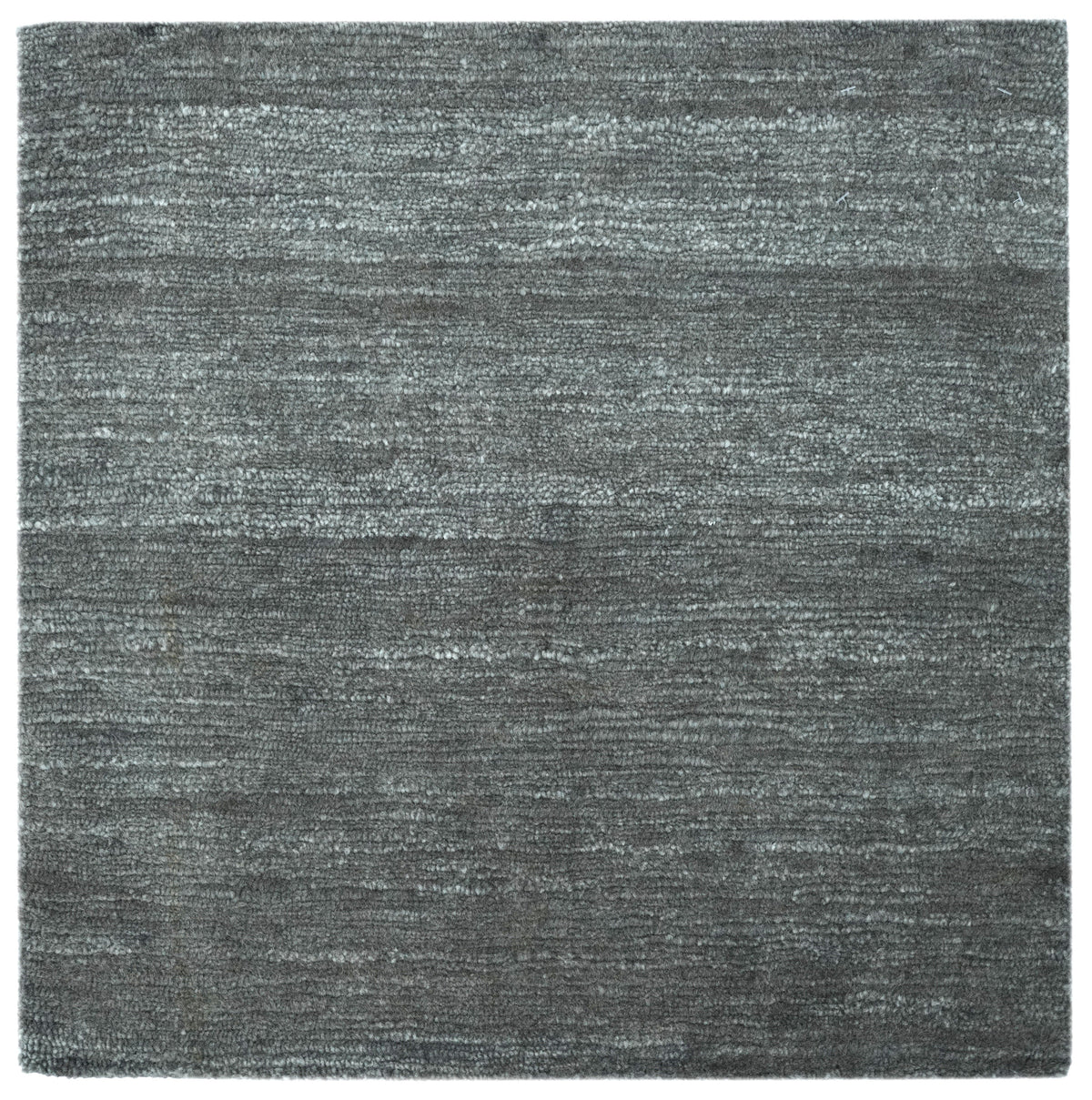 Alpaca Bloom in Charcoal, a Rugberry Reserve rug hand-knotted in alpaca, made entirely to measure