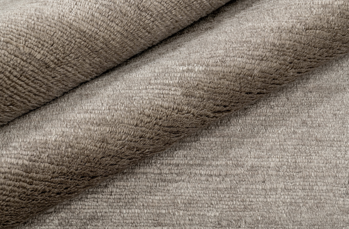 Six fibres, four continents, one piece at a time